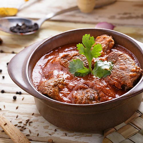 Traditional mutton curry with cilantro