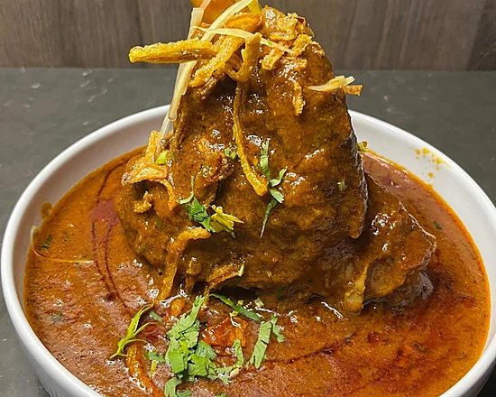 Awadhi lamb shank in rich gravy